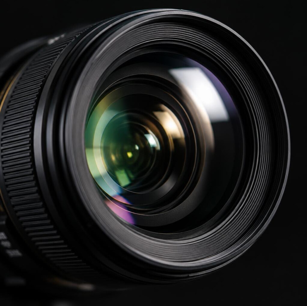 Camera lens close-up with soft reflections